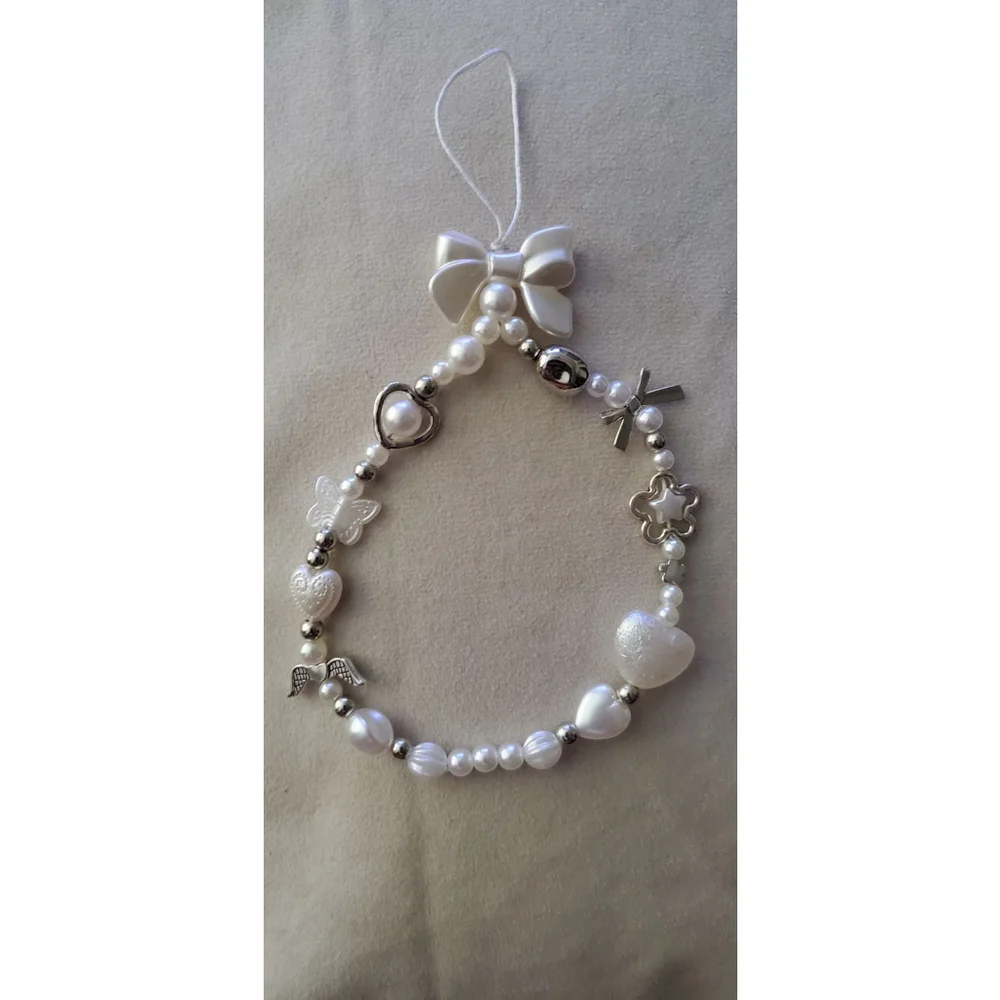 Phone chain with a variety of white & silver-tone beads, including faux pearls